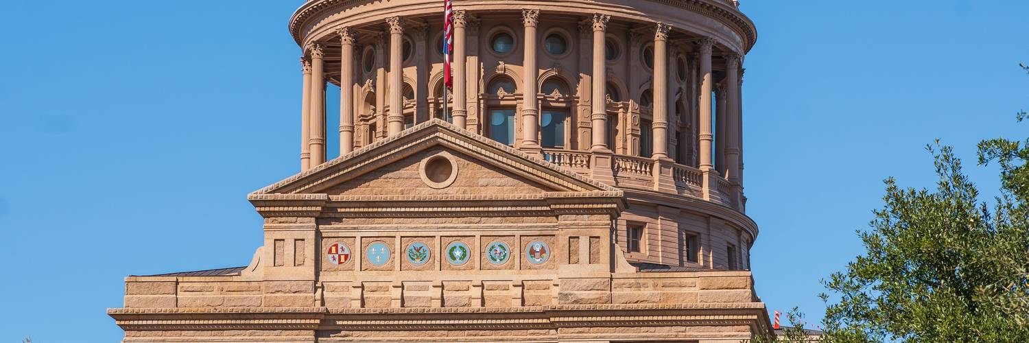  A photo depicting Texas auto insurance documents or paperwork, suggesting the administrative aspect of managing a policy, with a hint of Texas context 